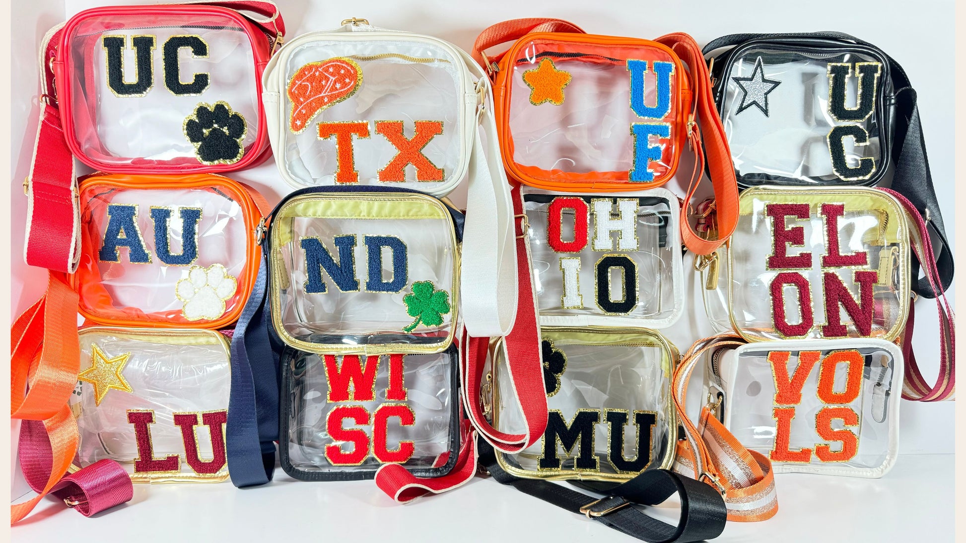 Collection of various clear game day purses with chenille letter patches 