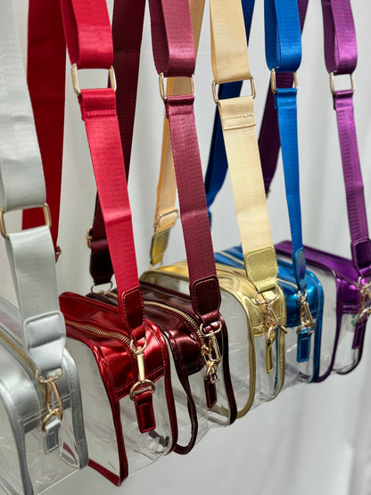 Collection of colorful handbags with matching straps on a white background